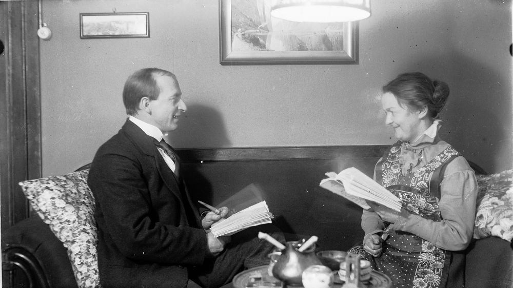 A man and a woman is reading.